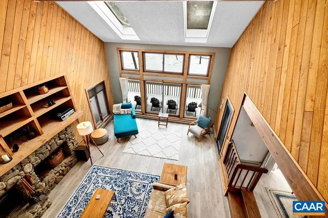 a view of a workspace with furniture and a bathroom