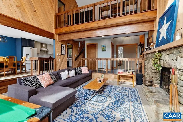 a view of a dining room with furniture wooden floor and chandelier