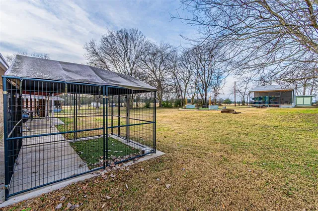 a view of a swimming pool with a yard