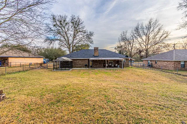a front view of a building with a yard