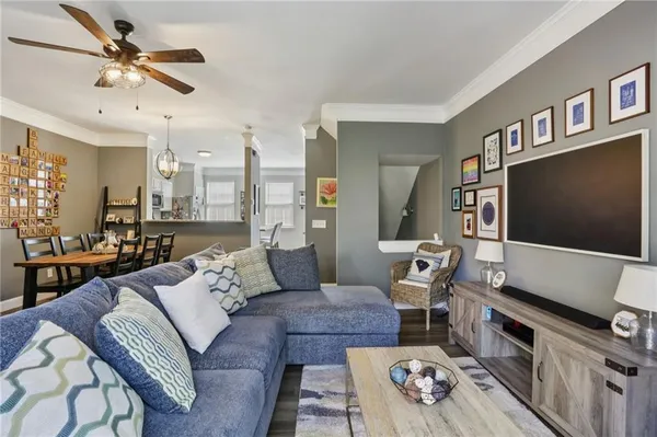 a living room with furniture and a flat screen tv