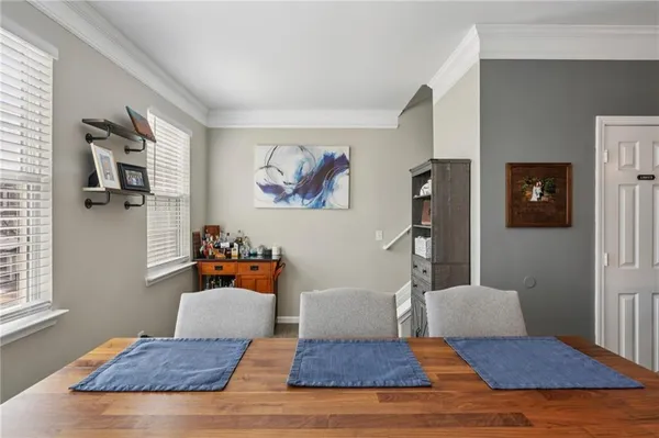 a living room with furniture wooden floor and a window