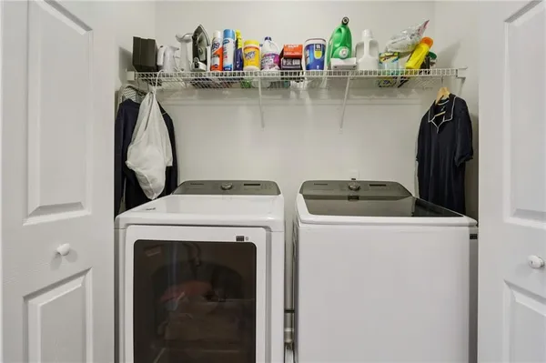 a utility room with dryer and washer