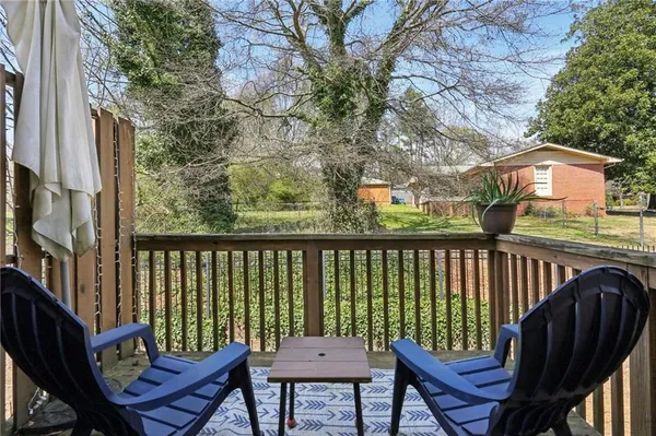 a view of a two chairs in the balcony