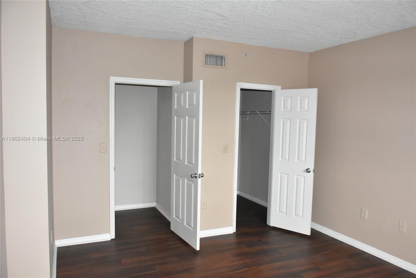 11701 Southwest 2nd Street, Unit 5305 Pembroke Pines, FL 33025 - Photo 11 of 27 an empty room with wooden floor & closet