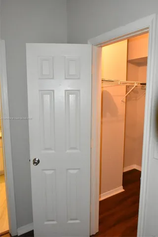 a view of front door with wooden floor