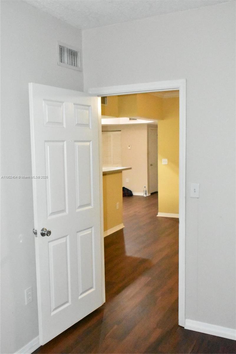 11701 Southwest 2nd Street, Unit 5305 Pembroke Pines, FL 33025 - Photo 27 of 27 a view of empty room with wooden floor and fan