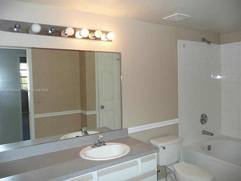 11701 Southwest 2nd Street, Unit 5305 Pembroke Pines, FL 33025 - Photo 5 of 27 a bathroom with a sink and a mirror