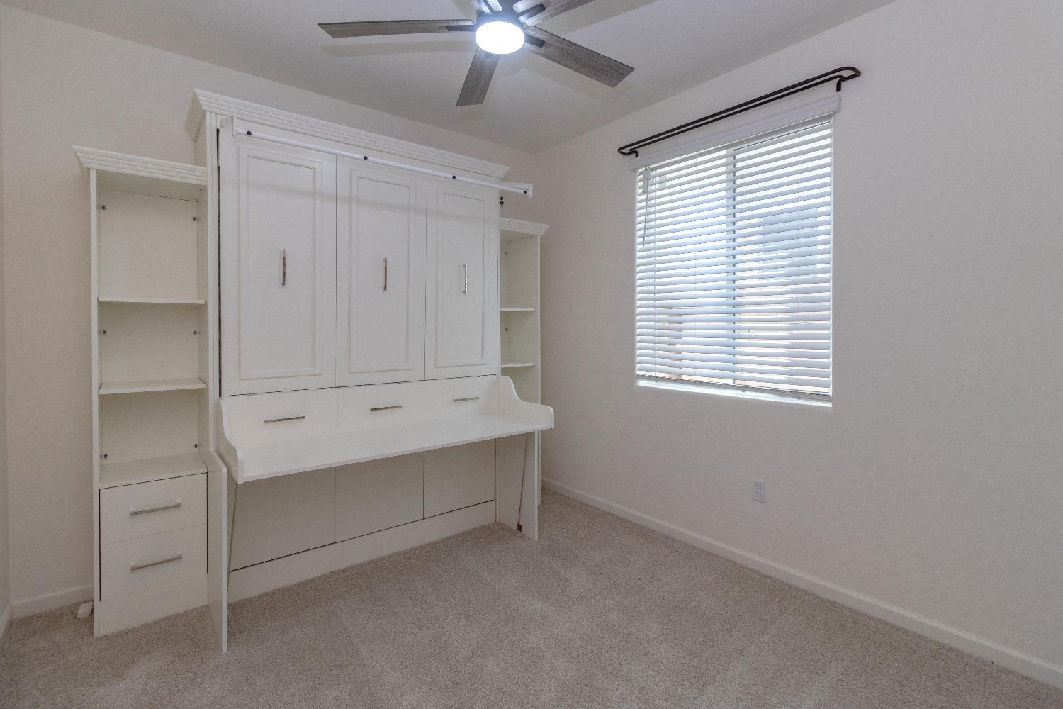 1158 Encore Way West Madera, CA 93636 - Photo 17 of 45 a view of an empty room with a window