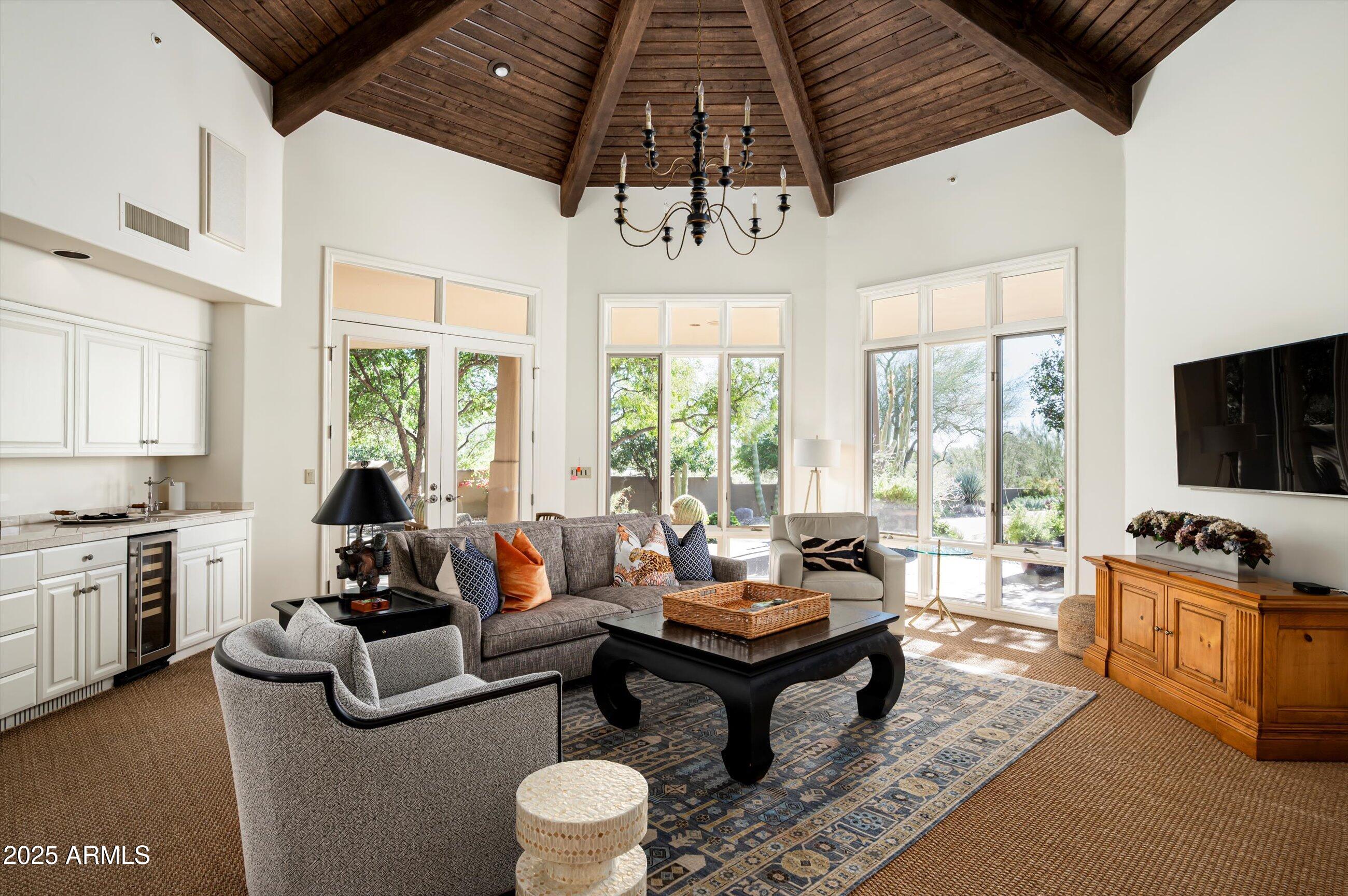 10040 East Happy Valley Road, Unit 274 Scottsdale, AZ 85255 - Photo 12 of 73 a living room with furniture ceiling fan and a rug