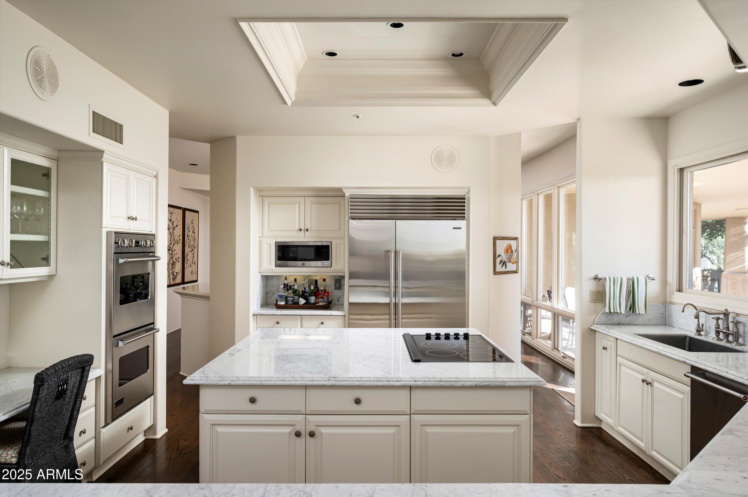 10040 East Happy Valley Road, Unit 274 Scottsdale, AZ 85255 - Photo 19 of 73 a kitchen with a sink stove and refrigerator