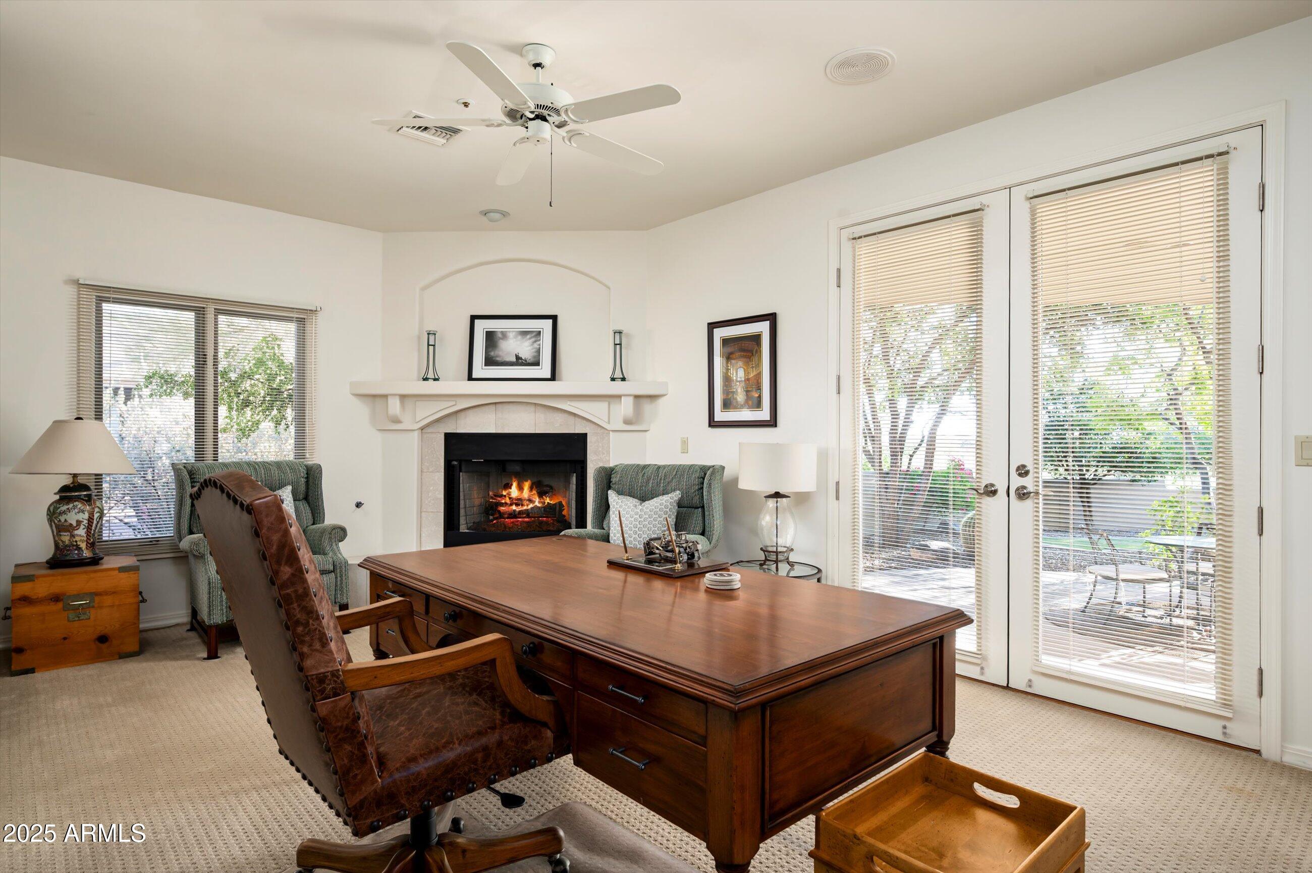 10040 East Happy Valley Road, Unit 274 Scottsdale, AZ 85255 - Photo 26 of 73 a view of a livingroom with furniture and a fireplace
