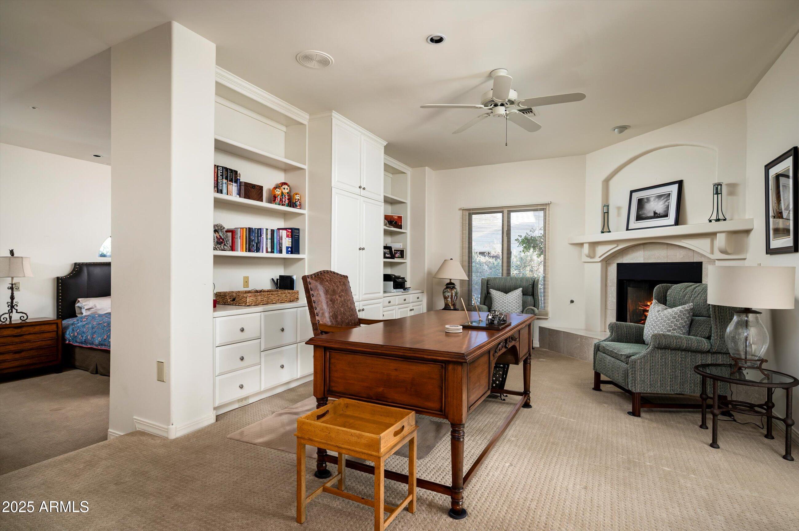 10040 East Happy Valley Road, Unit 274 Scottsdale, AZ 85255 - Photo 27 of 73 a living room with furniture and a fireplace