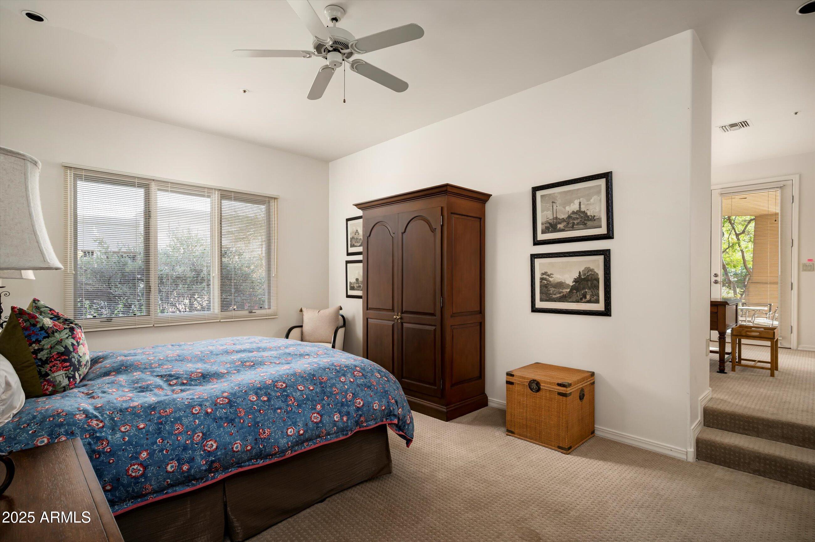 10040 East Happy Valley Road, Unit 274 Scottsdale, AZ 85255 - Photo 29 of 73 a bedroom with a bed and a painting on the wall