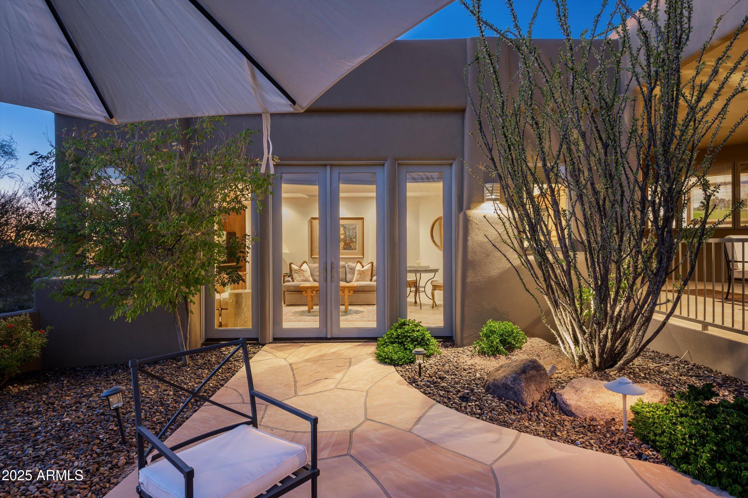 10040 East Happy Valley Road, Unit 274 Scottsdale, AZ 85255 - Photo 37 of 73 a view of a patio with couple of chairs and potted plants