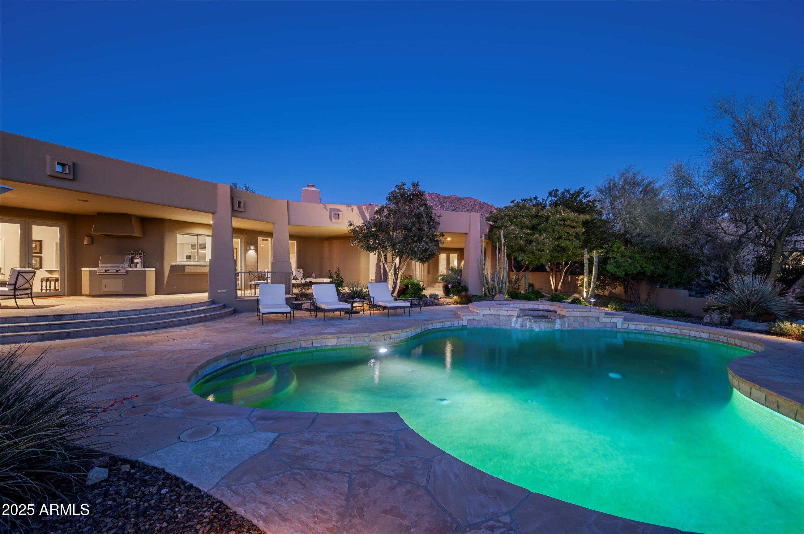 10040 East Happy Valley Road, Unit 274 Scottsdale, AZ 85255 - Photo 46 of 73 a view of a swimming pool with a patio