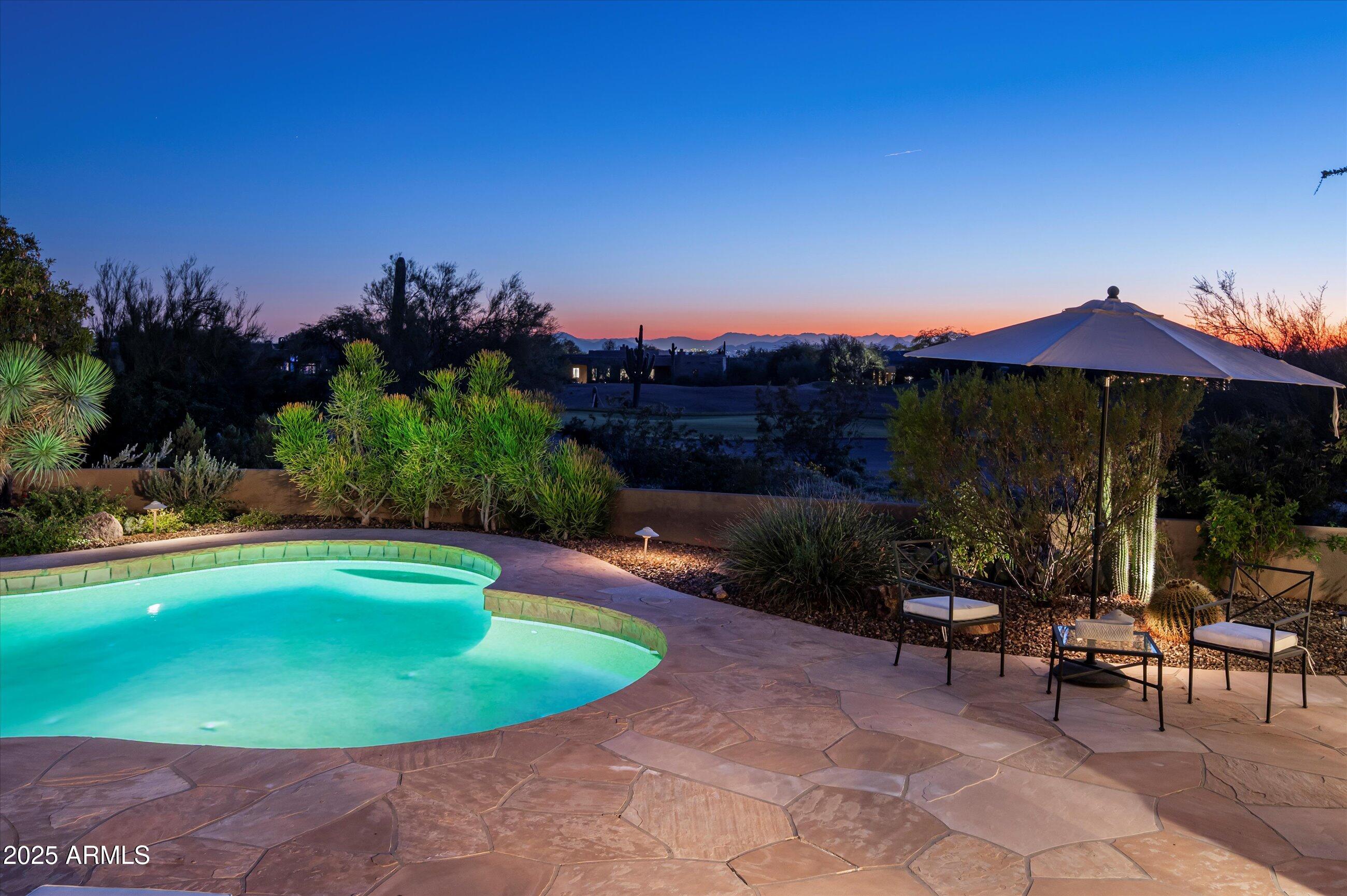10040 East Happy Valley Road, Unit 274 Scottsdale, AZ 85255 - Photo 48 of 73 a view of a swimming pool with a patio