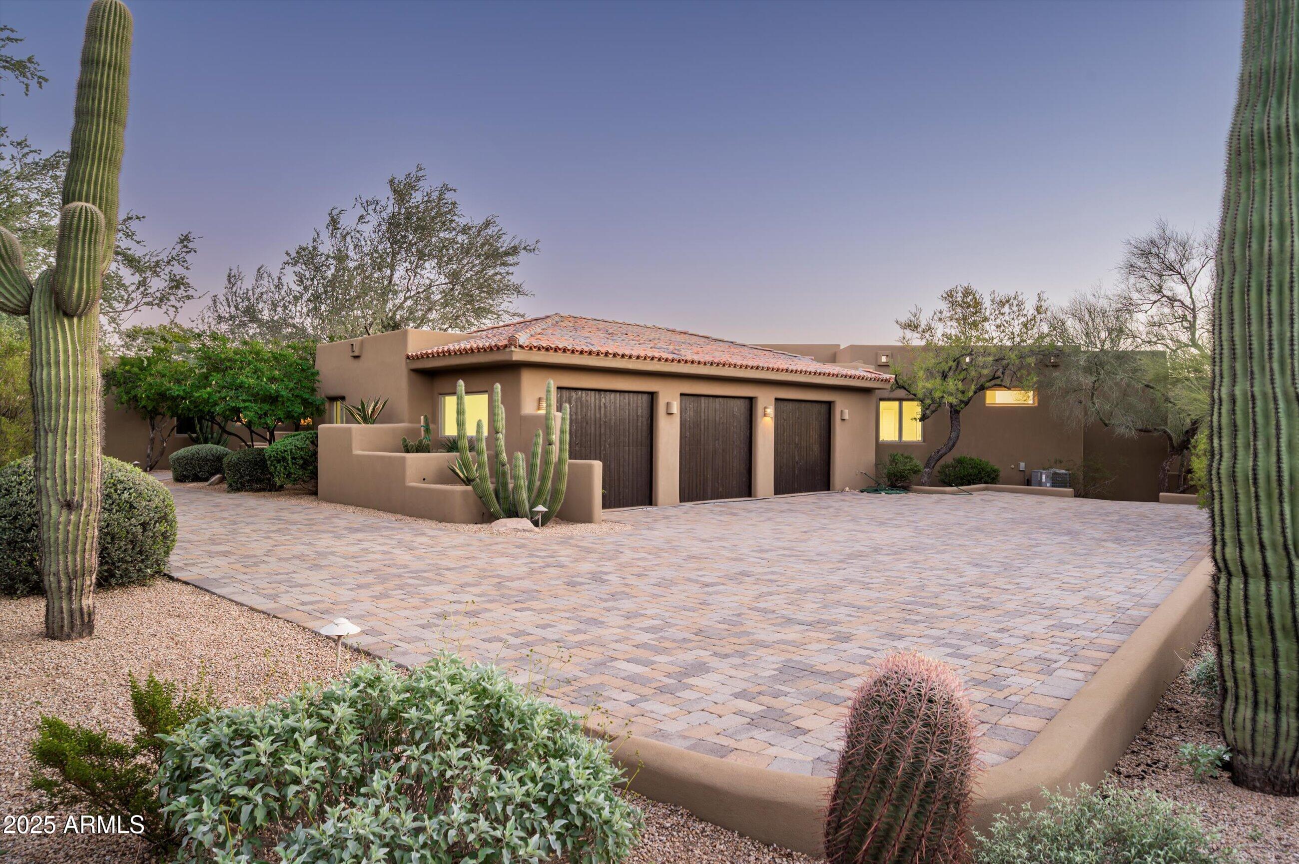 10040 East Happy Valley Road, Unit 274 Scottsdale, AZ 85255 - Photo 61 of 73 a front view of a house with a yard