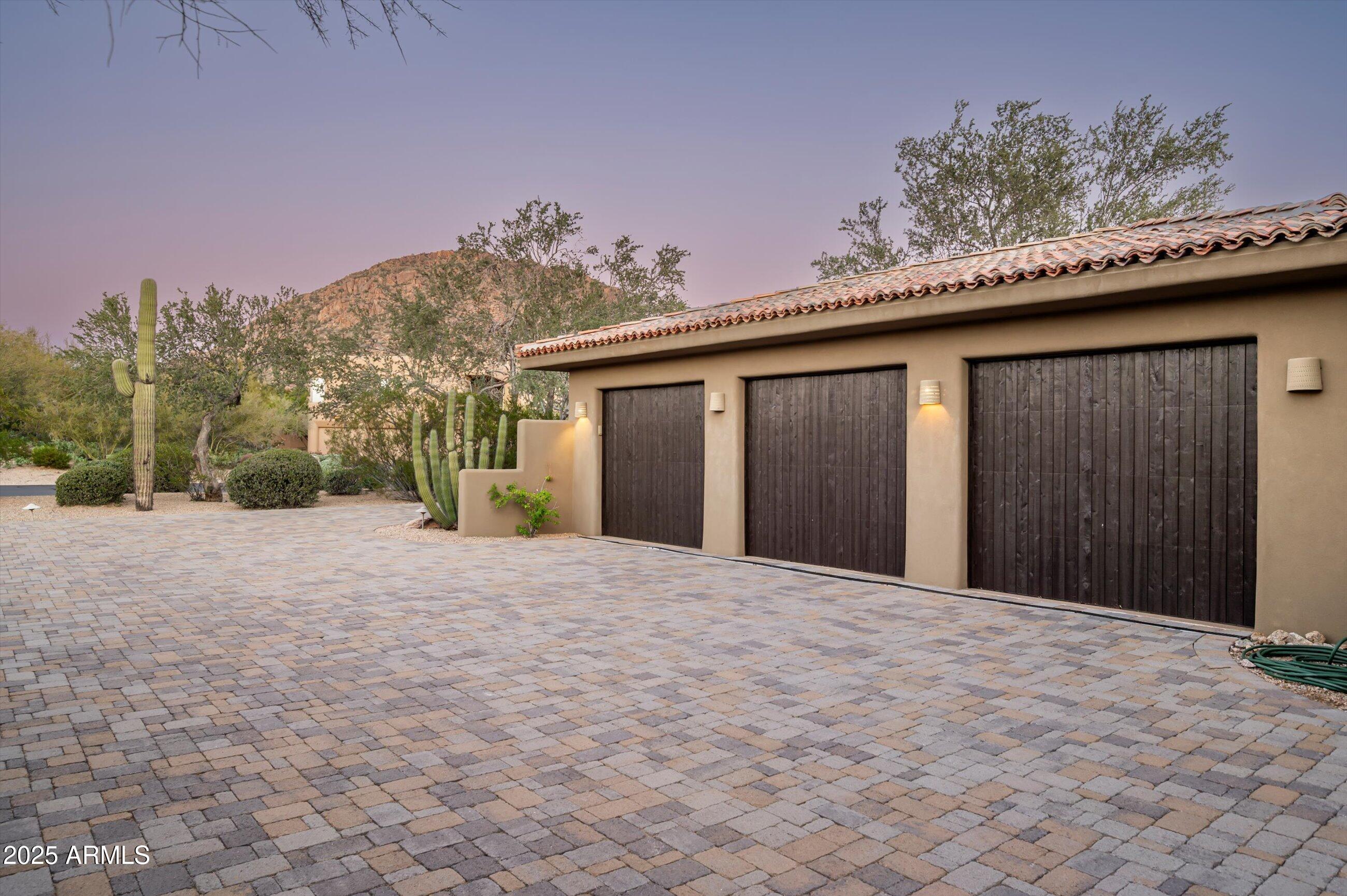 10040 East Happy Valley Road, Unit 274 Scottsdale, AZ 85255 - Photo 62 of 73 a view of a house with a yard and garage