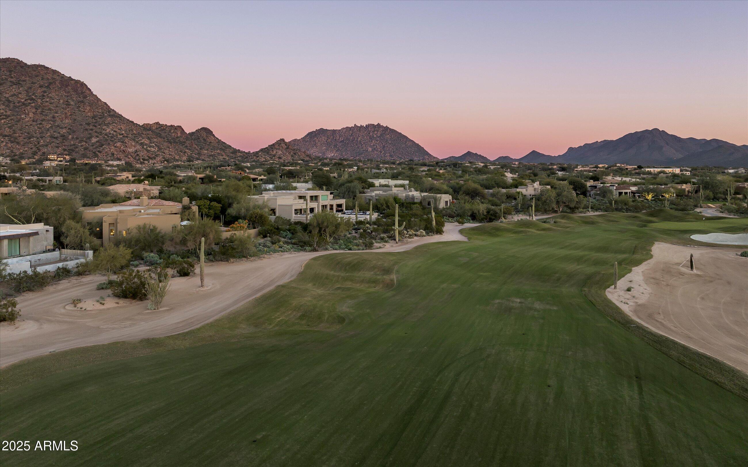 10040 East Happy Valley Road, Unit 274 Scottsdale, AZ 85255 - Photo 66 of 73 a view of a town with mountains in the background