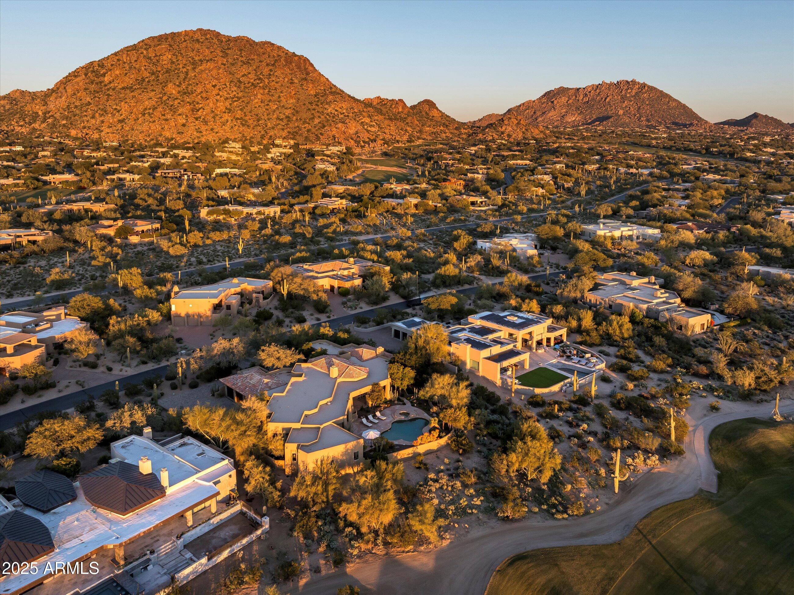 10040 East Happy Valley Road, Unit 274 Scottsdale, AZ 85255 - Photo 70 of 73 an aerial view of residential houses and car parked