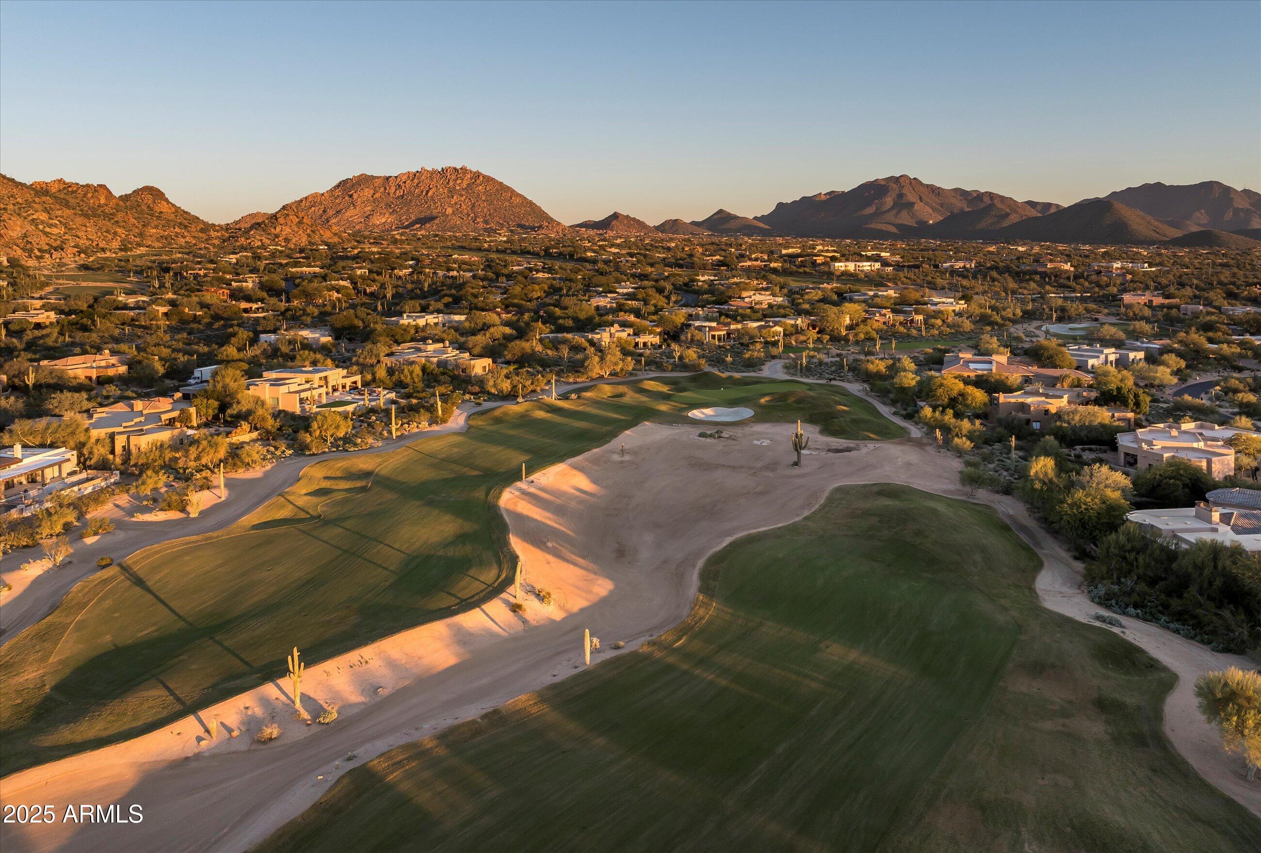 10040 East Happy Valley Road, Unit 274 Scottsdale, AZ 85255 - Photo 71 of 73 a view of a town with mountains in the background