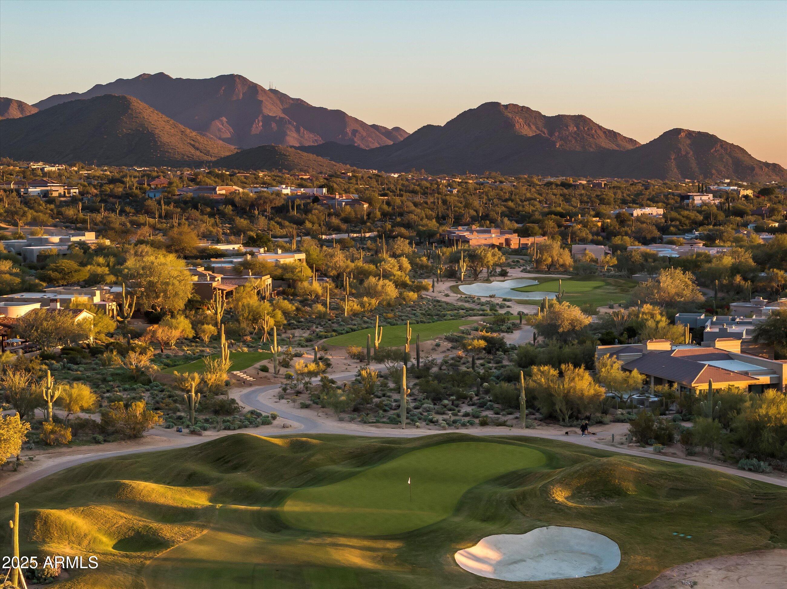 10040 East Happy Valley Road, Unit 274 Scottsdale, AZ 85255 - Photo 72 of 73 a view of a city with mountains in the background
