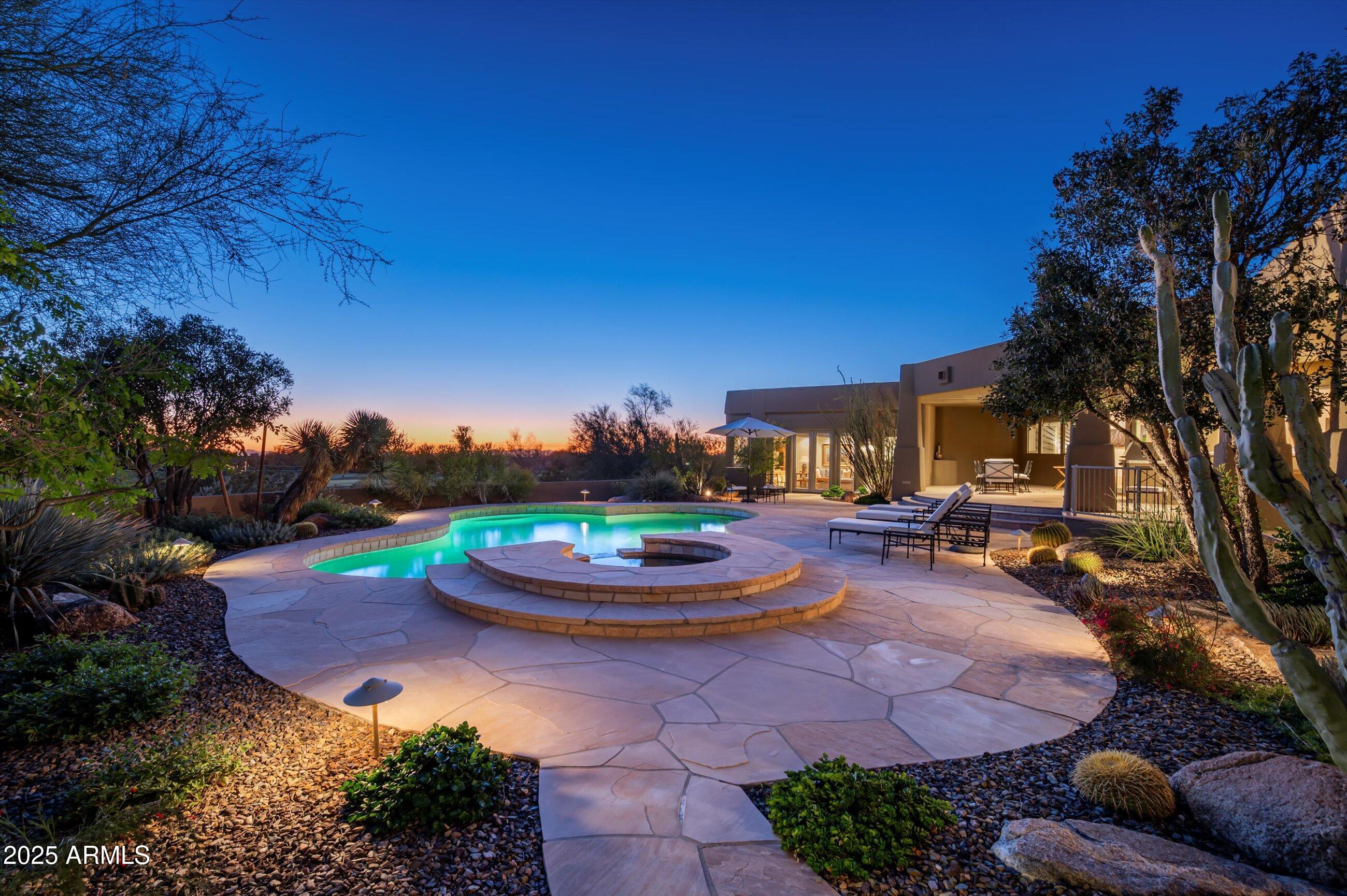 10040 East Happy Valley Road, Unit 274 Scottsdale, AZ 85255 - Photo 8 of 73 a view of a backyard with plants and a patio