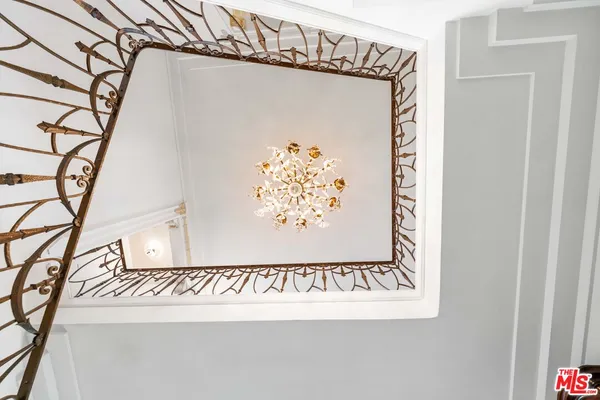 a view of an entryway with wooden floor and a chandelier