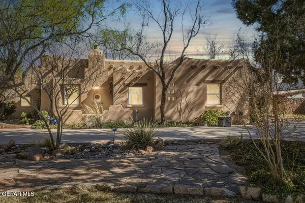 a view of a yard with a tree