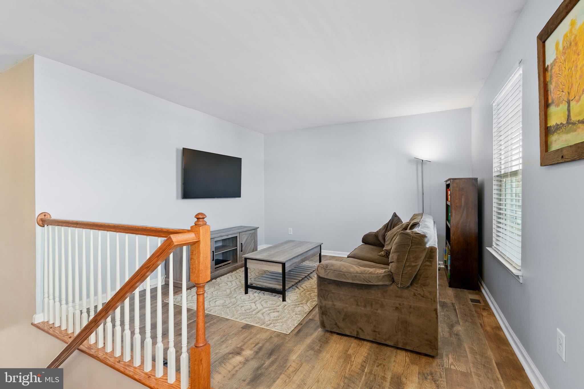 144 Abbigail Crossing Townsend, DE 19734 - Photo 17 of 33 a living room with furniture and a flat screen tv