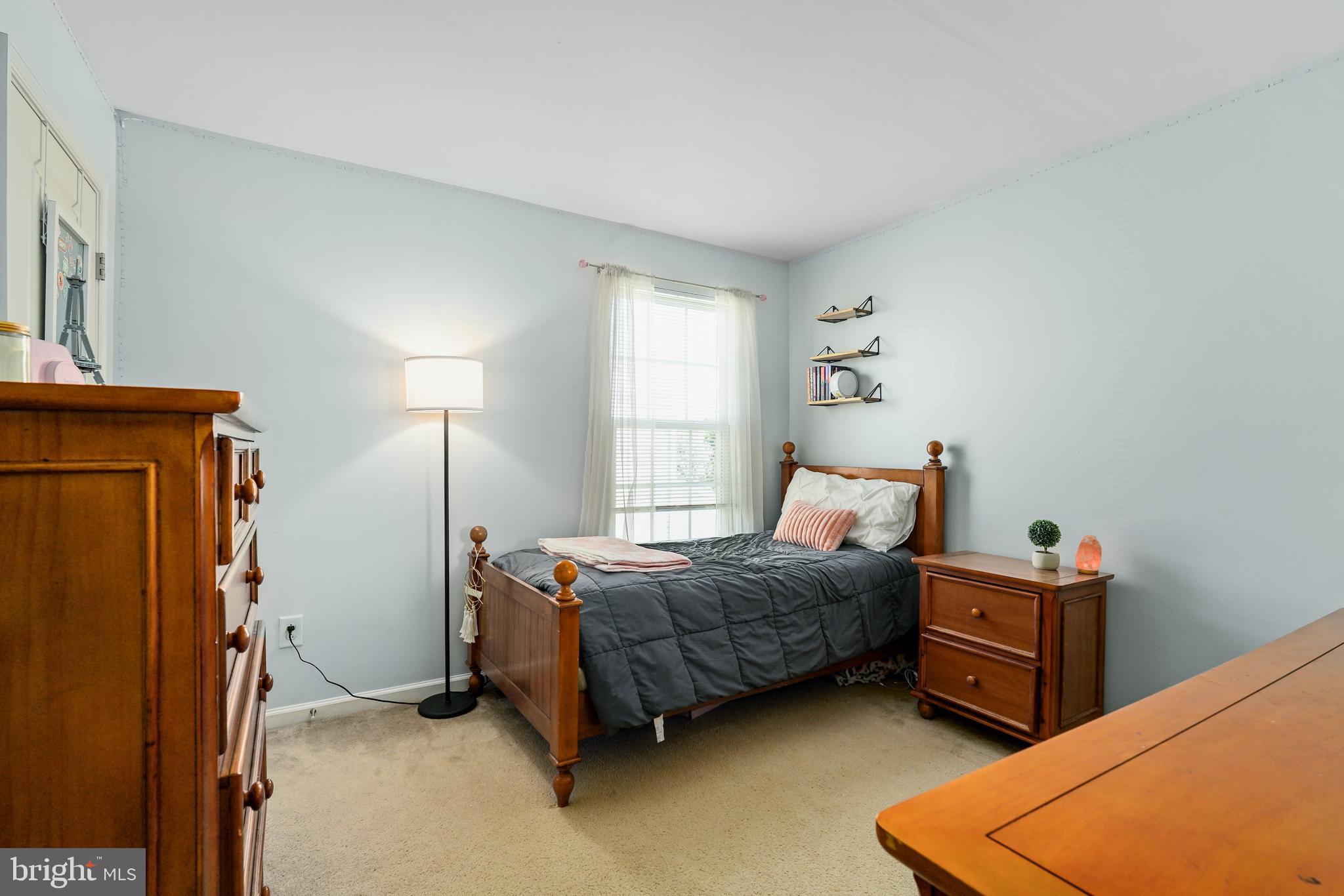 144 Abbigail Crossing Townsend, DE 19734 - Photo 20 of 33 a bedroom with a bed and a dresser