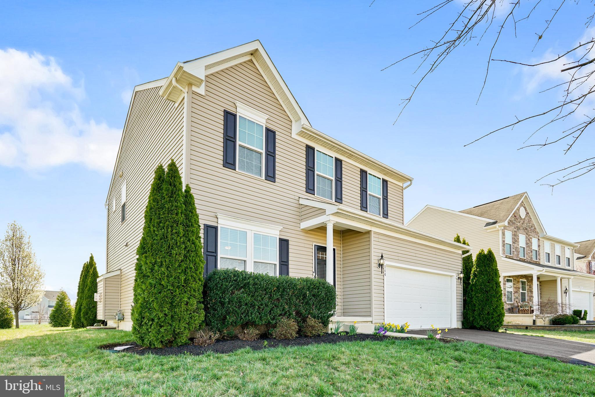 144 Abbigail Crossing Townsend, DE 19734 - Photo 3 of 33 a front view of a house with a yard