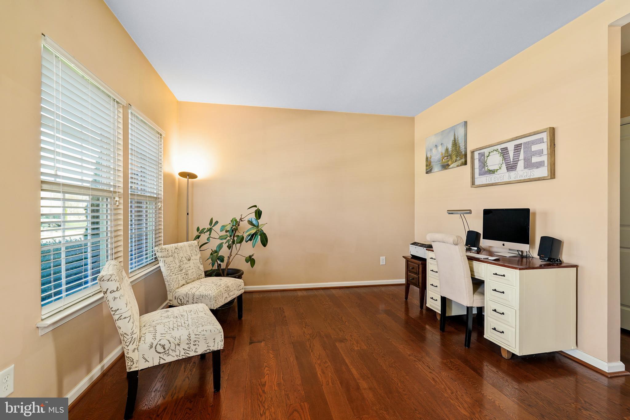 144 Abbigail Crossing Townsend, DE 19734 - Photo 5 of 33 a view of a workspace with furniture and wooden floor
