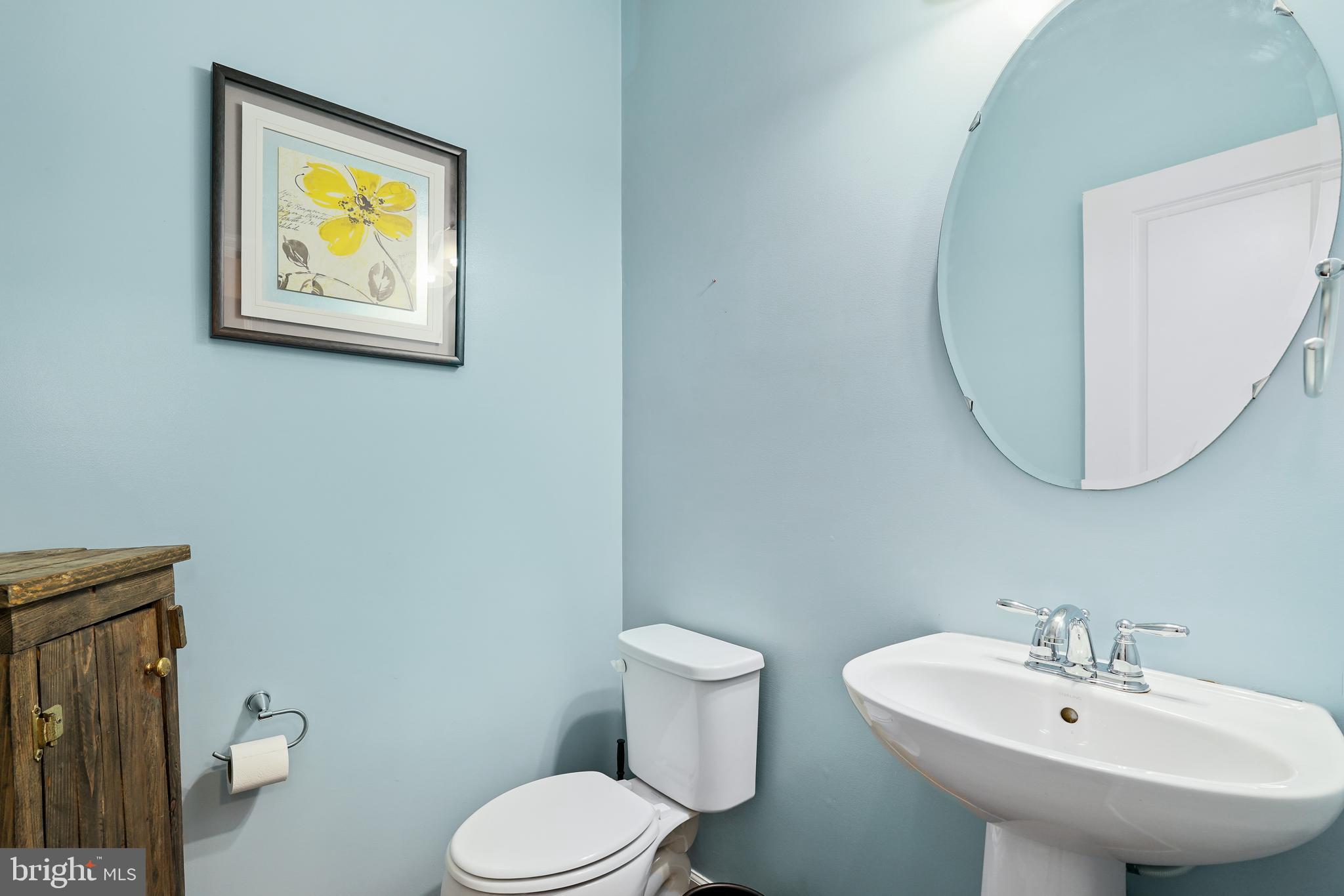 144 Abbigail Crossing Townsend, DE 19734 - Photo 7 of 33 a bathroom with a toilet sink and mirror