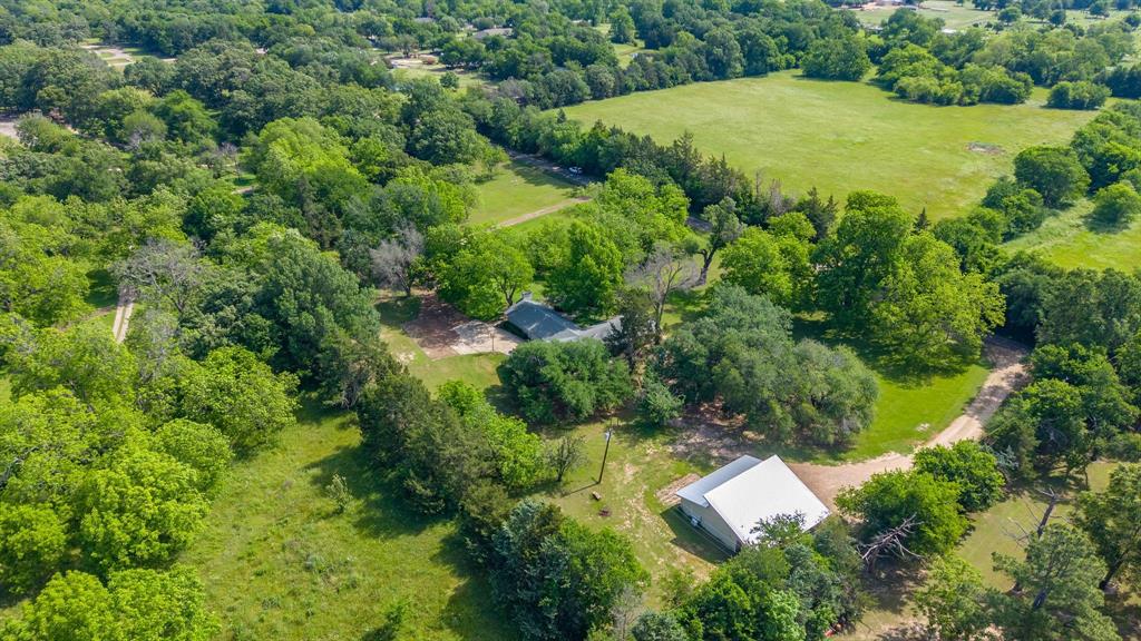 96 Southeast 12th Street Cooper, TX 75432 - Photo 29 of 32 an aerial view of residential house with outdoor space and trees all around