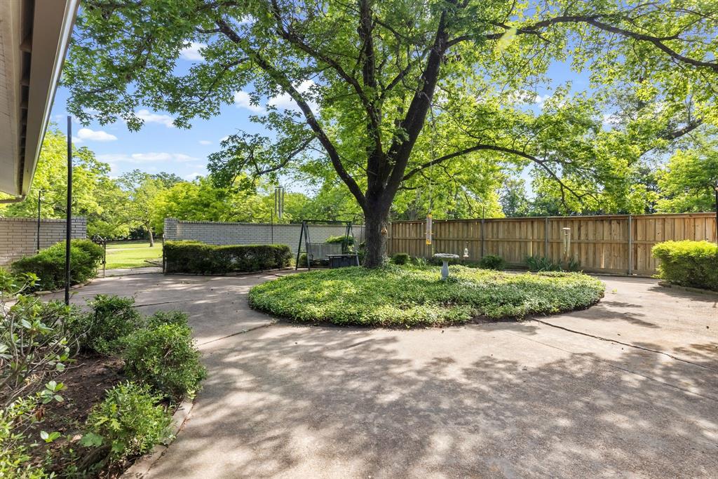 96 Southeast 12th Street Cooper, TX 75432 - Photo 3 of 32 a view of a garden with large trees