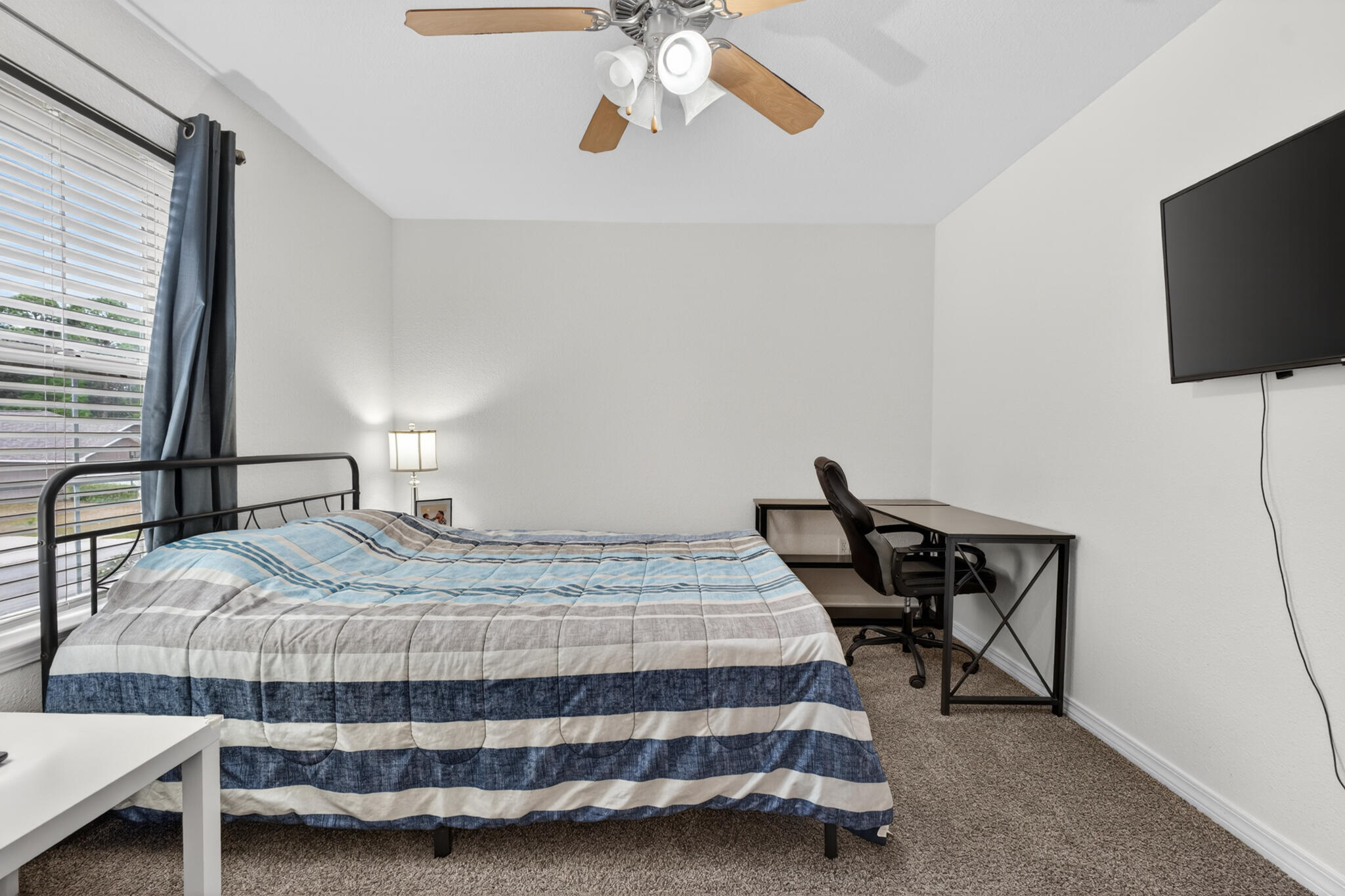 268 Loblolly Bay Drive Santa Rosa Beach, FL 32459 - Photo 32 of 73 a bedroom with a bed and a flat screen tv
