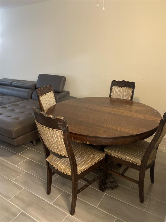 3117 Mission Grove Drive Palm Harbor, FL 34684 - Photo 11 of 25 a living room with a couch and a table