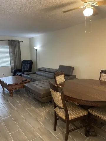 a workspace with furniture and chandelier