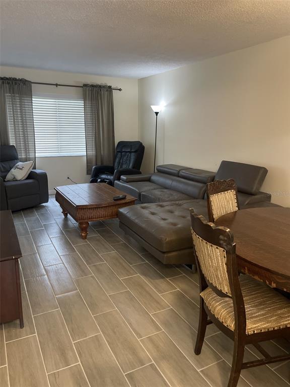 3117 Mission Grove Drive Palm Harbor, FL 34684 - Photo 13 of 25 a bedroom with furniture and a window