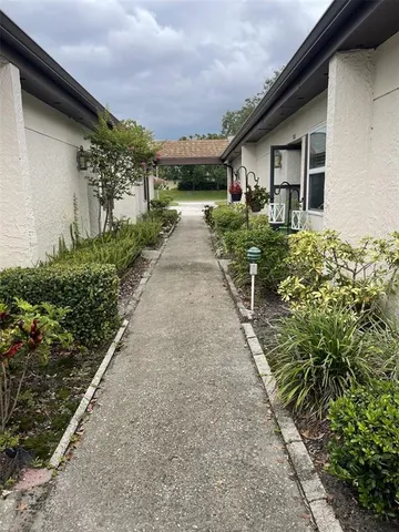 a view of a pathway with house on both side
