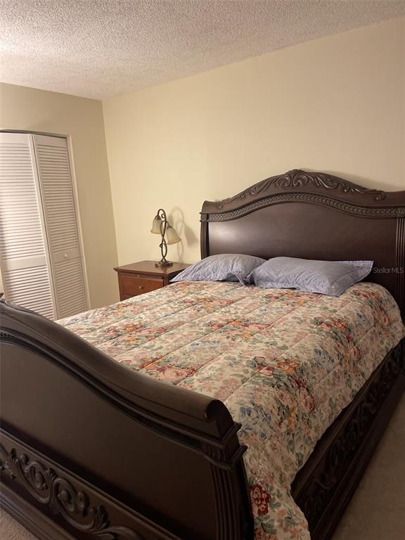 3117 Mission Grove Drive Palm Harbor, FL 34684 - Photo 9 of 25 a bedroom with a bed