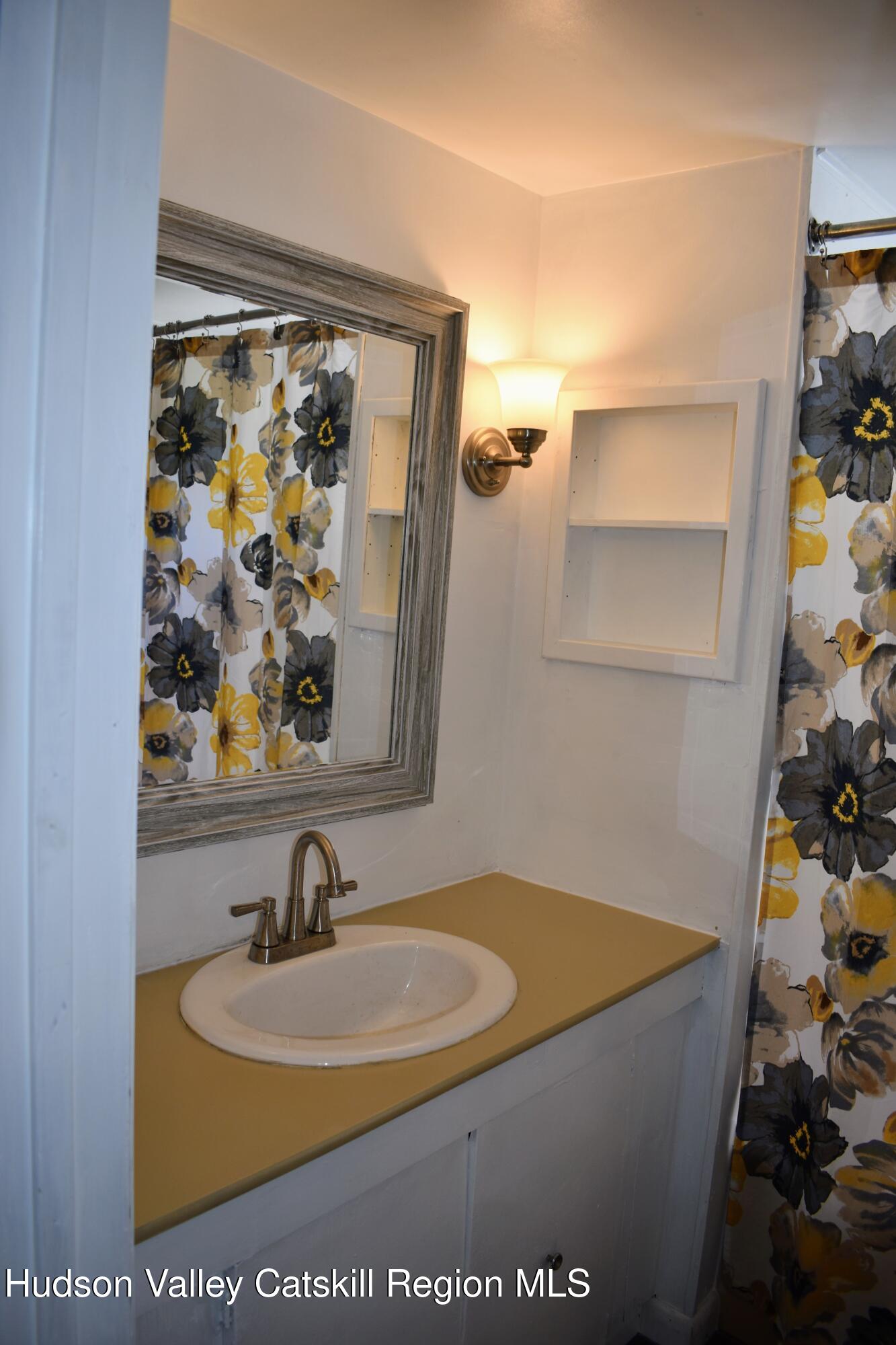 64 Dashville Road New Paltz, NY 12561 - Photo 16 of 45 a bathroom with a sink and a mirror