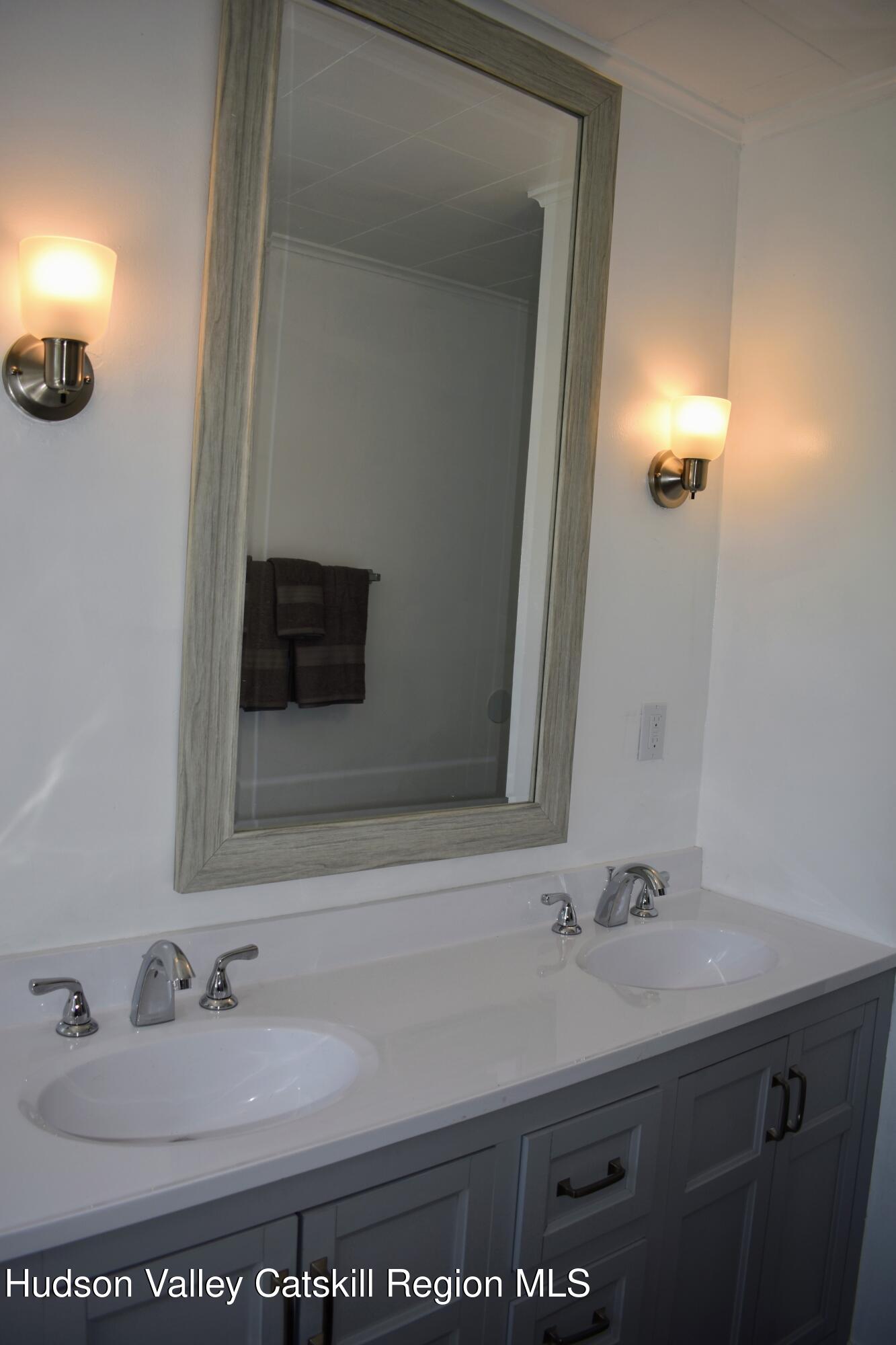 64 Dashville Road New Paltz, NY 12561 - Photo 17 of 45 a bathroom with a sink and a mirror