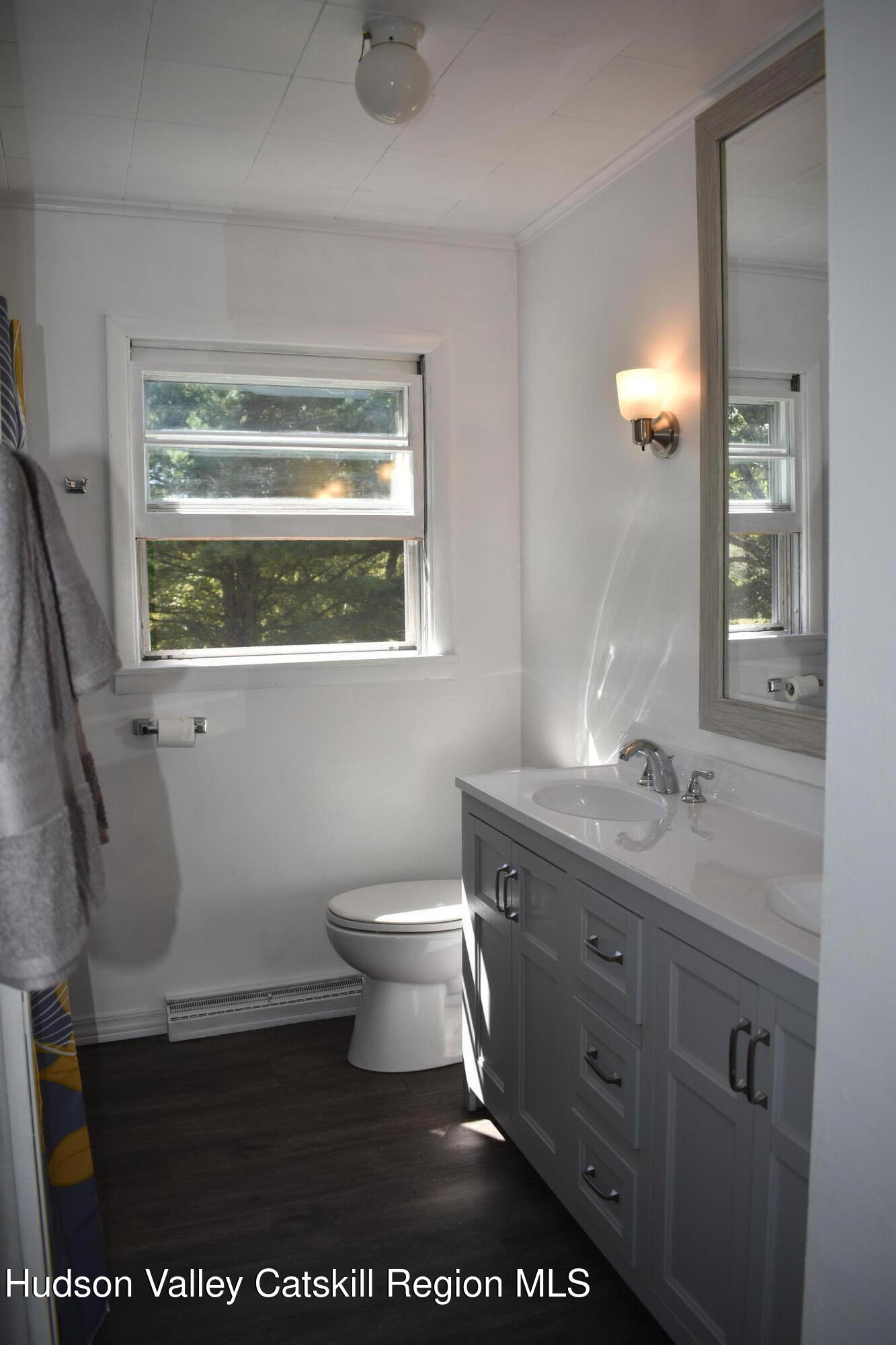 64 Dashville Road New Paltz, NY 12561 - Photo 18 of 45 a bathroom with a toilet sink and mirror