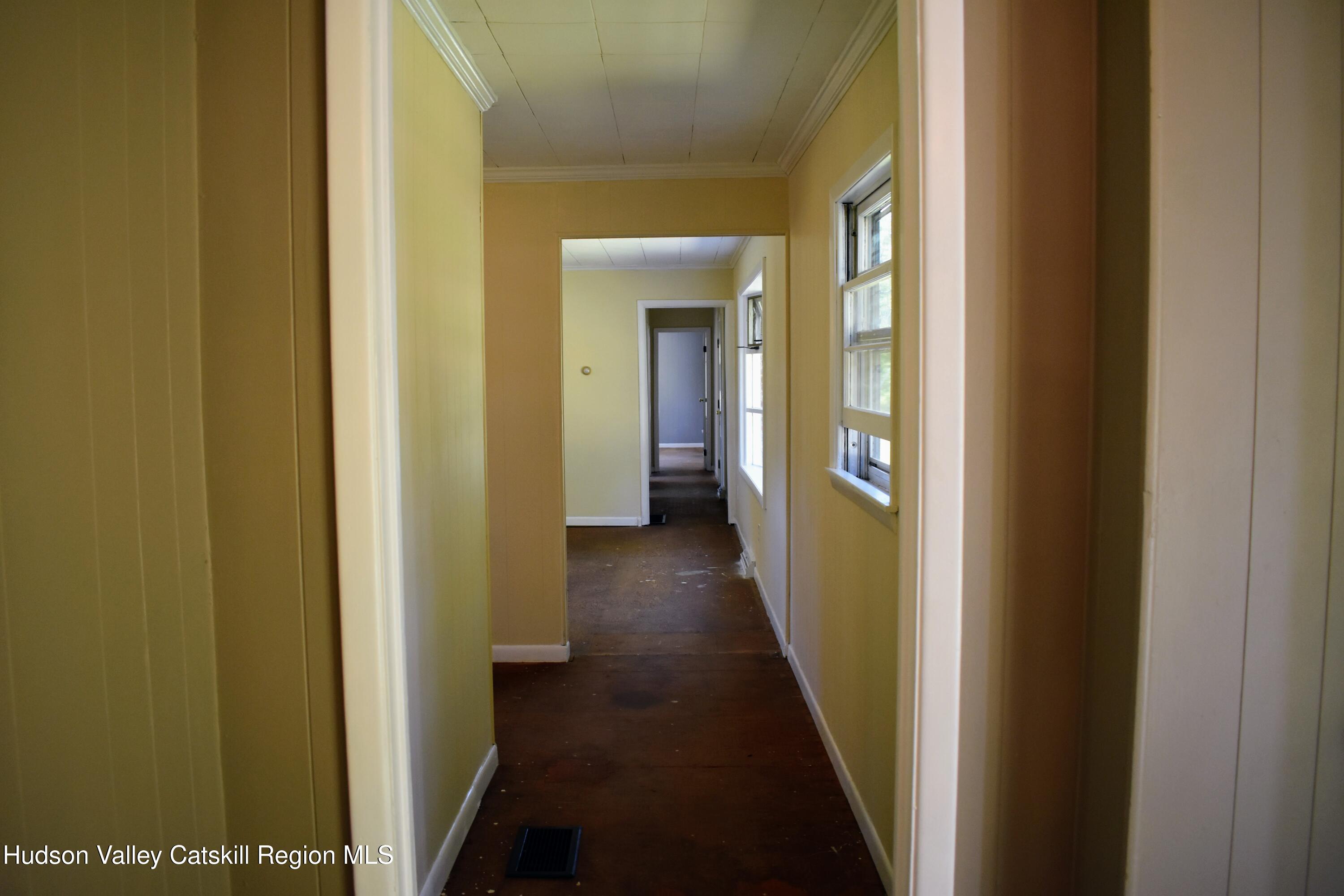 64 Dashville Road New Paltz, NY 12561 - Photo 36 of 45 a view of a hallway with wooden floor