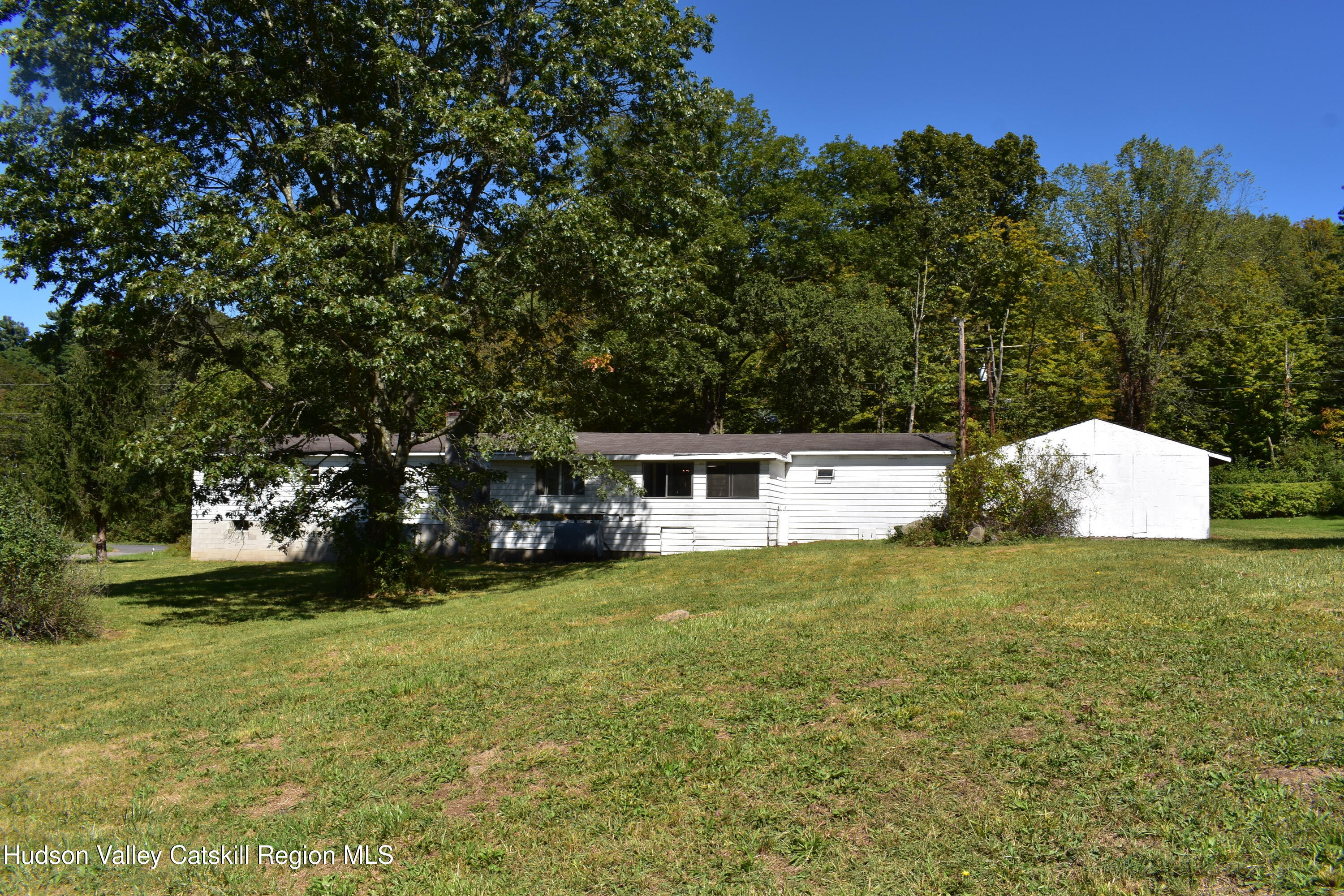 64 Dashville Road New Paltz, NY 12561 - Photo 42 of 45 a white house that has a tree in front of it