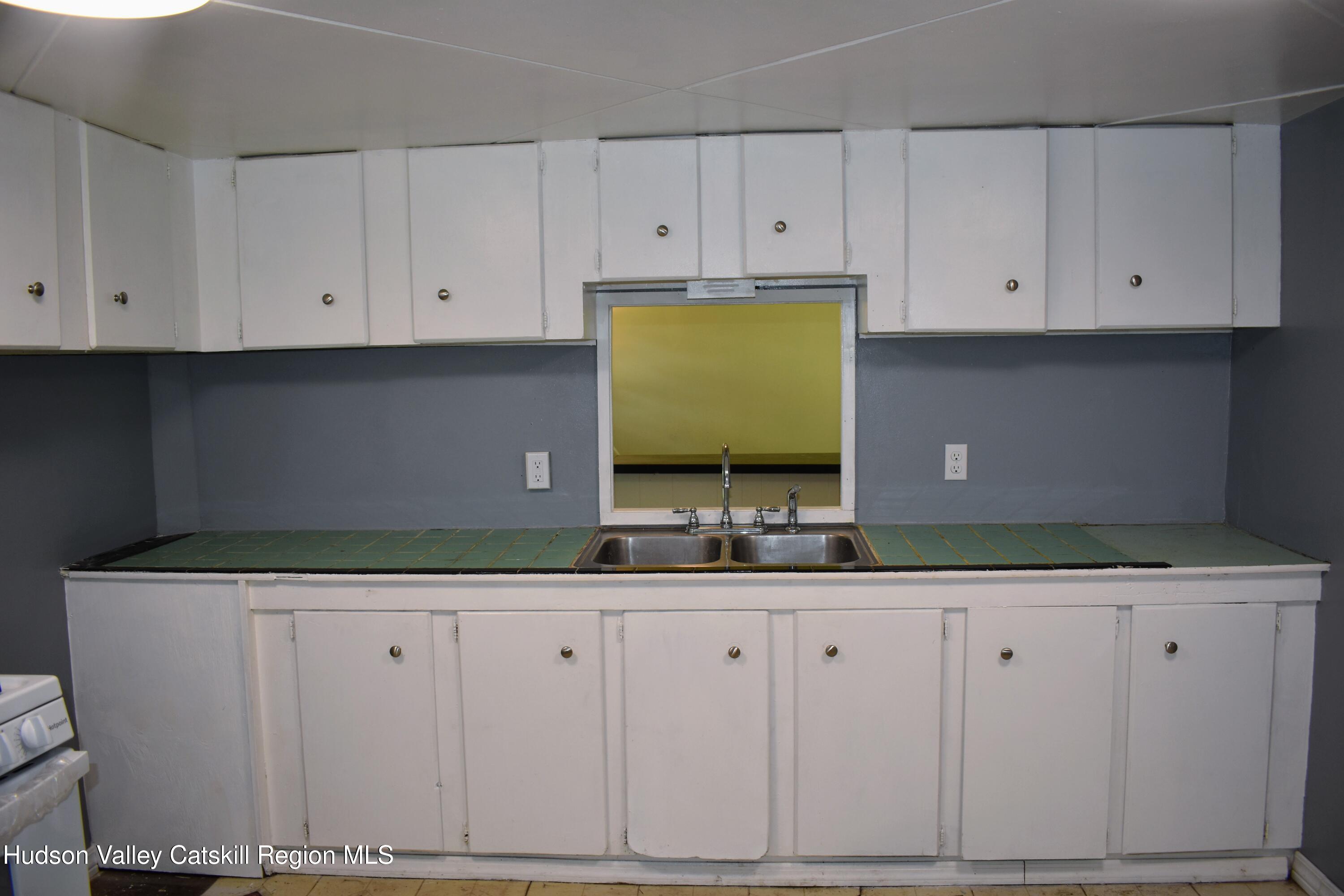 64 Dashville Road New Paltz, NY 12561 - Photo 9 of 45 a kitchen with white cabinets