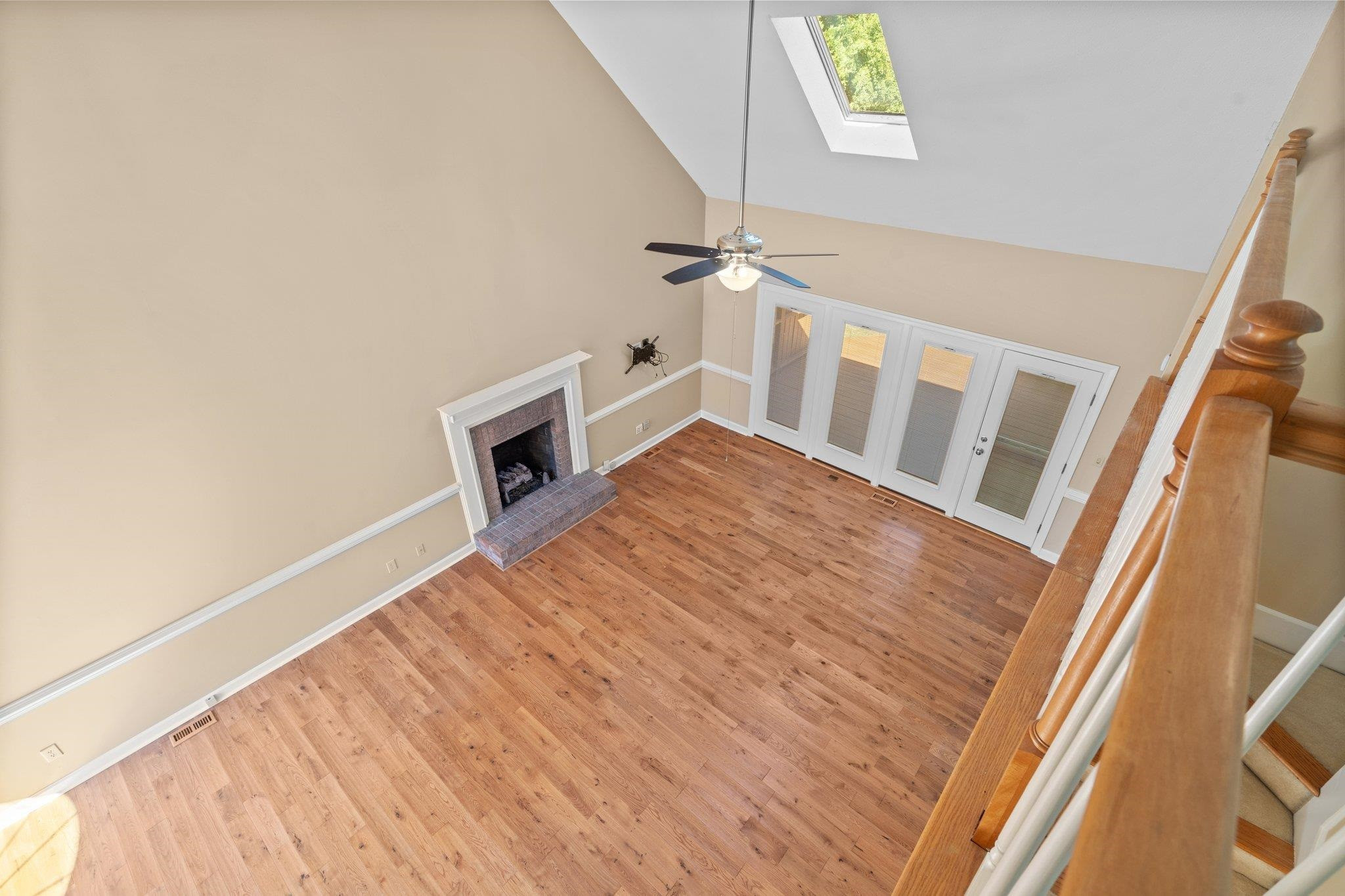 3320 Harden Road Raleigh, NC 27607 - Photo 36 of 42 a view of an empty room with wooden floor and a window
